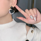Boucles d'oreilles cœur en or noir
